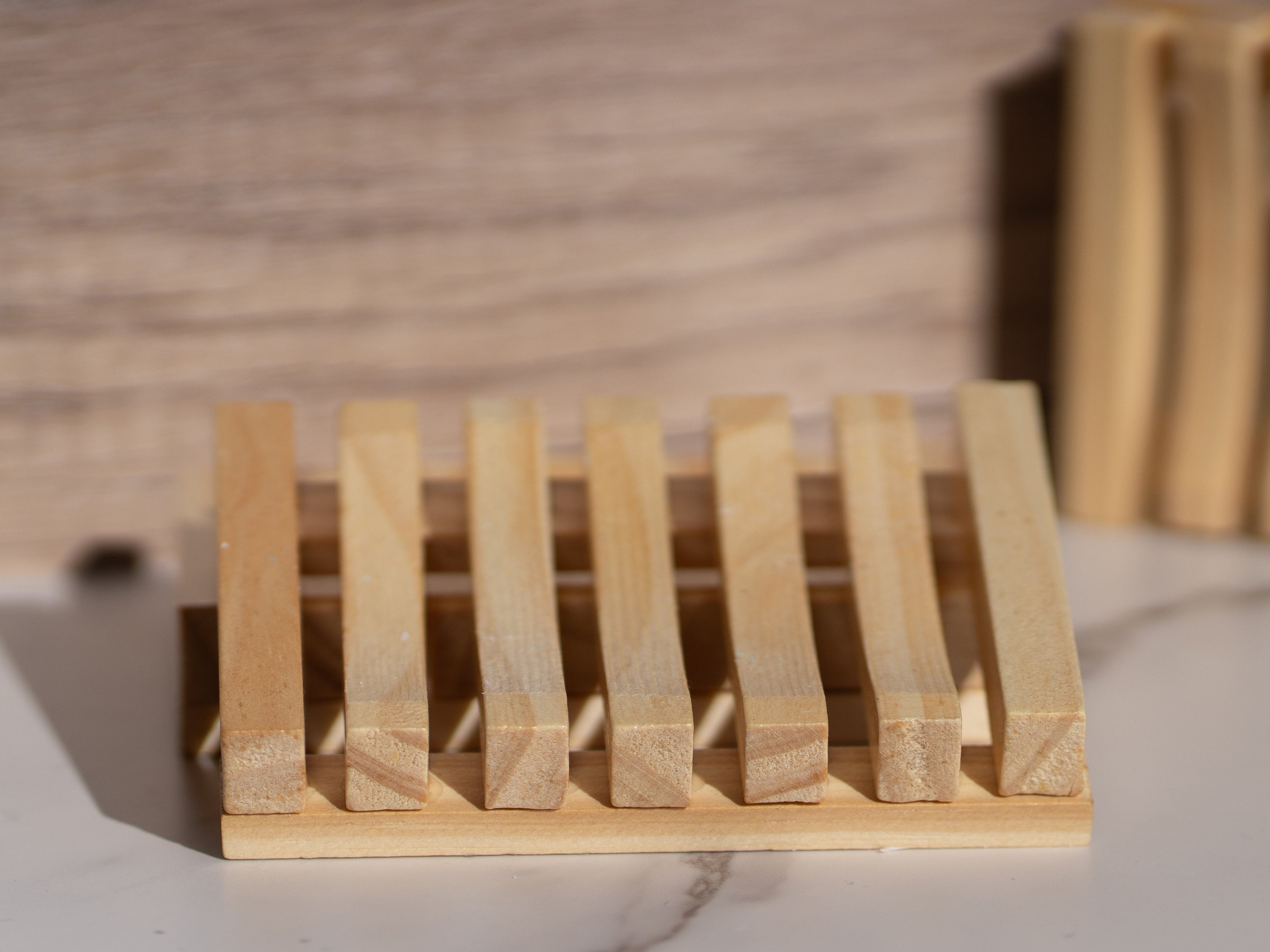 Eco-friendly wooden soap dish with a Cloudy Soap handmade bar