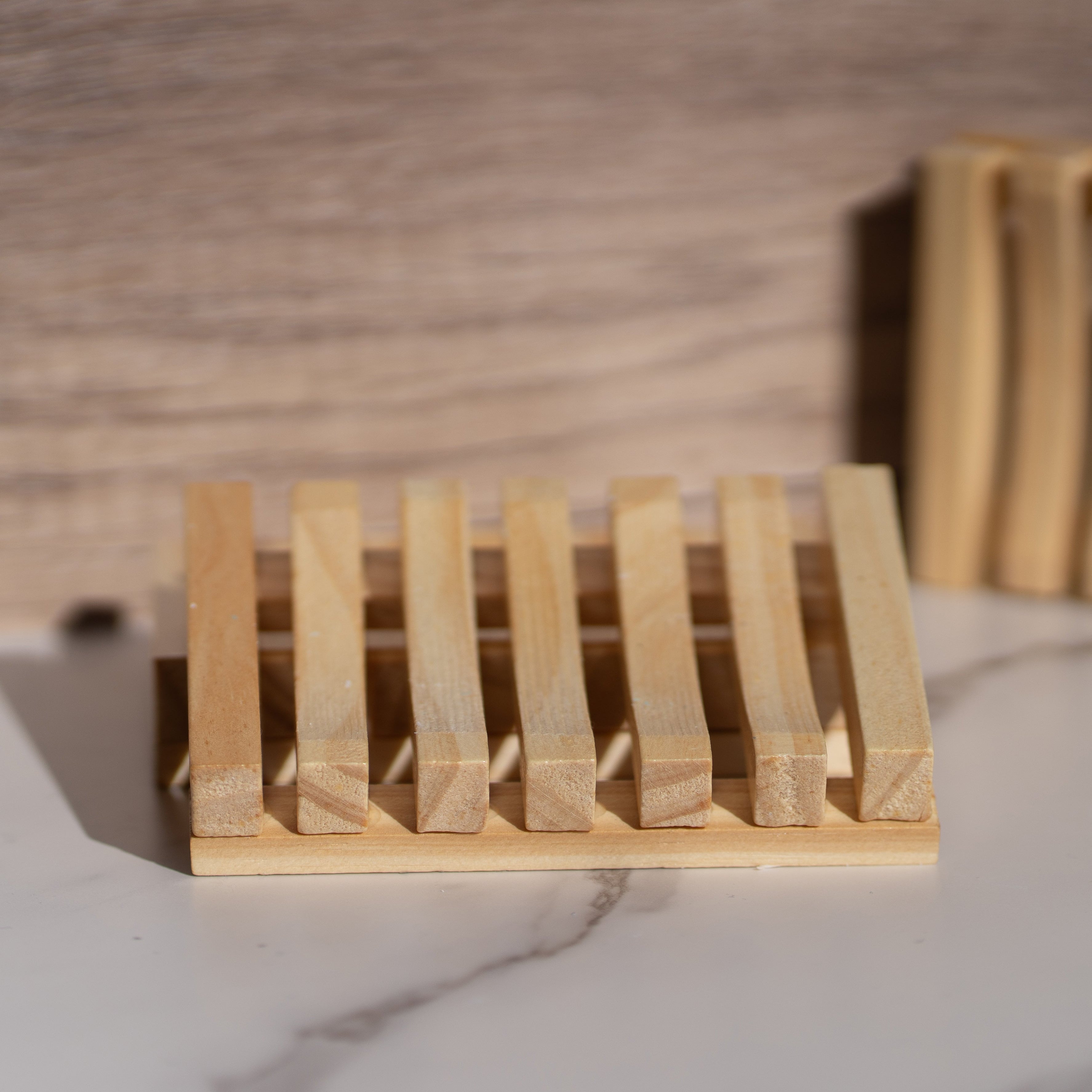 Eco-friendly wooden soap dish with a Cloudy Soap handmade bar